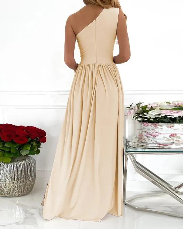 Apricot one-shoulder sleeveless maxi dress with a high split, shown on a model.