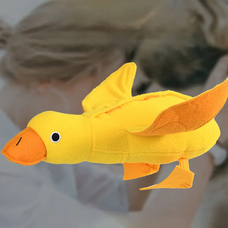Yellow teddy dog toy with duck sound feature and treat dispensing openings for training
