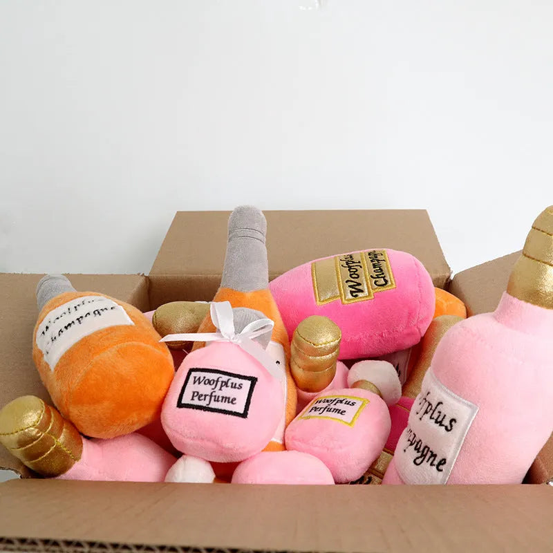 Plush wine bottle shaped pet toy for dogs and cats in assorted colours.