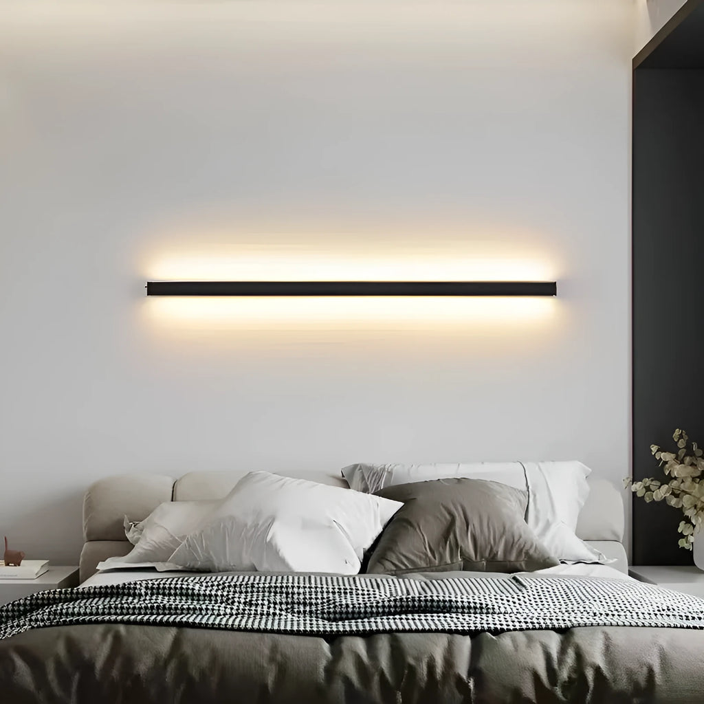 80cm long black aluminium LED strip wall lamp mounted on a wall, showing its simple linear design.