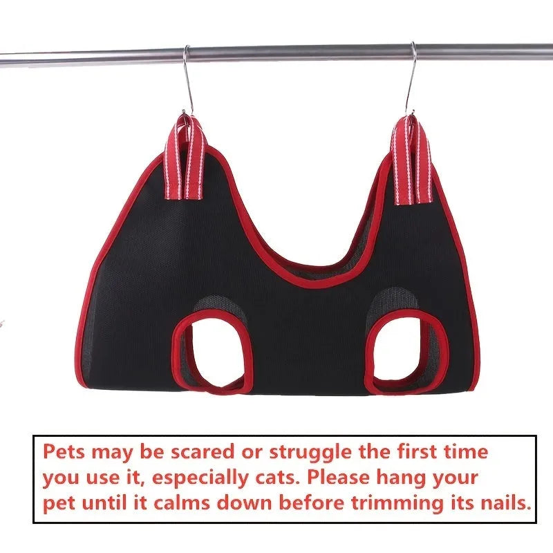 Hanging pet grooming restraint hammock bag in use for dog nail trimming.