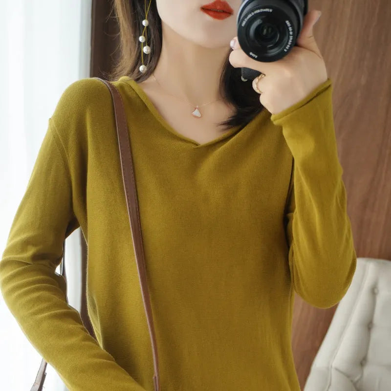 Women's V-neck long sleeve knitwear top in wine red colour, laid flat.