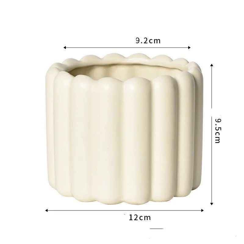 Roman column style matte yellow ceramic flowerpot for home plant decoration.