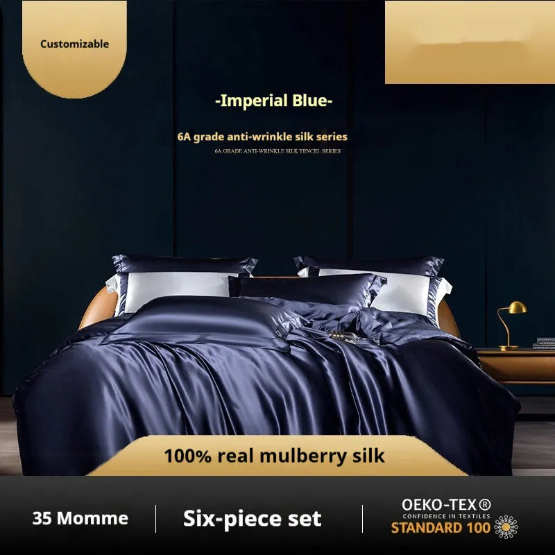 Solid colour silk four-piece quilt cover set shown in a light luxury bedroom setting.