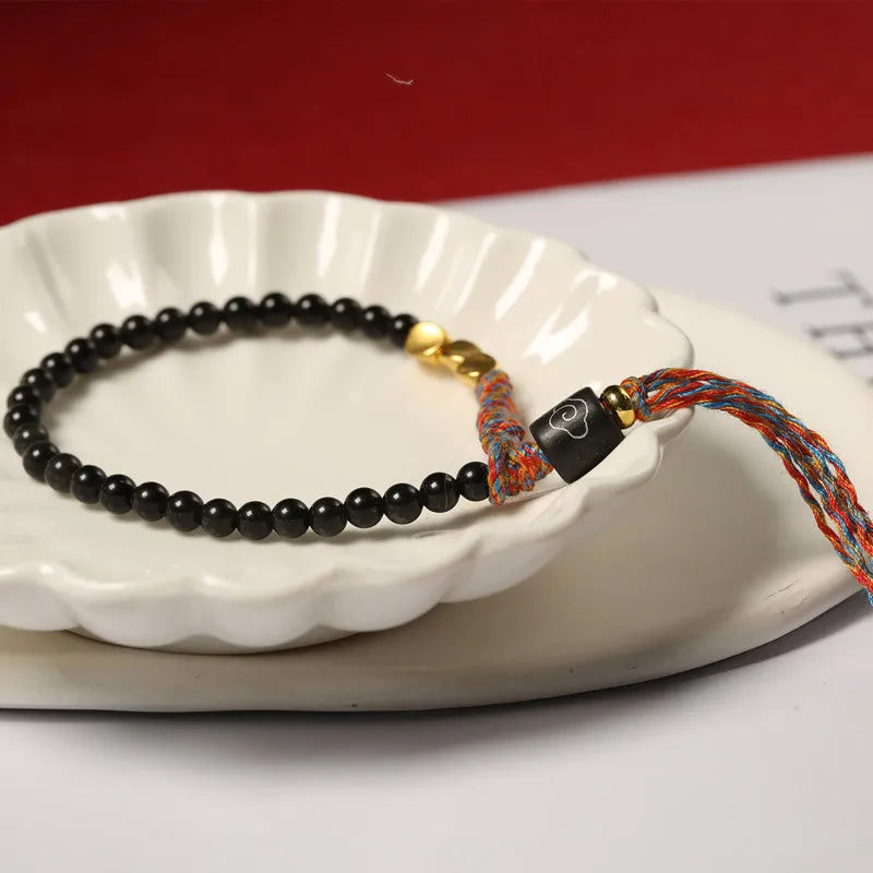 Hand-woven obsidian colour carrying strap bracelet with 4mm width and woven texture