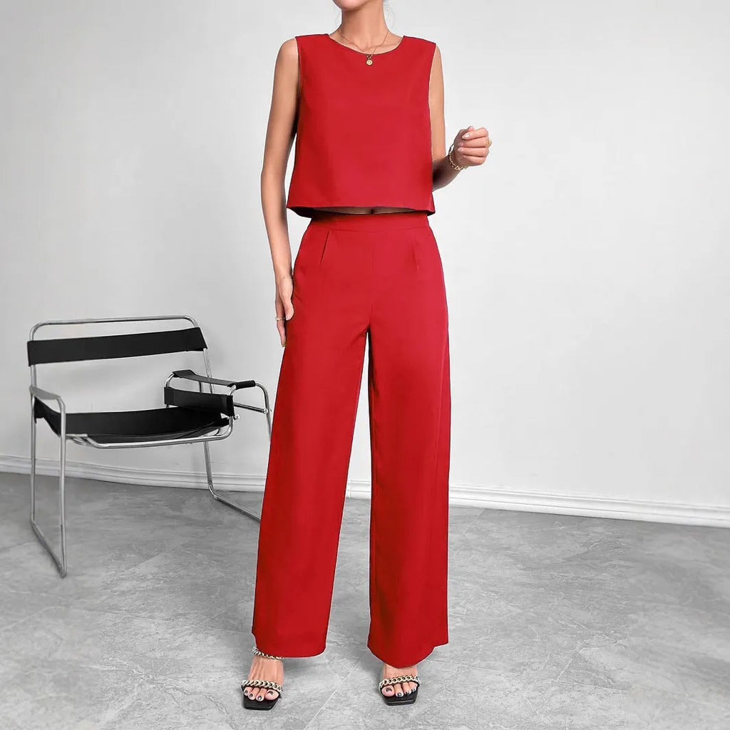 Women's red polyester lounge set featuring sleeveless round neck top and wide leg pants