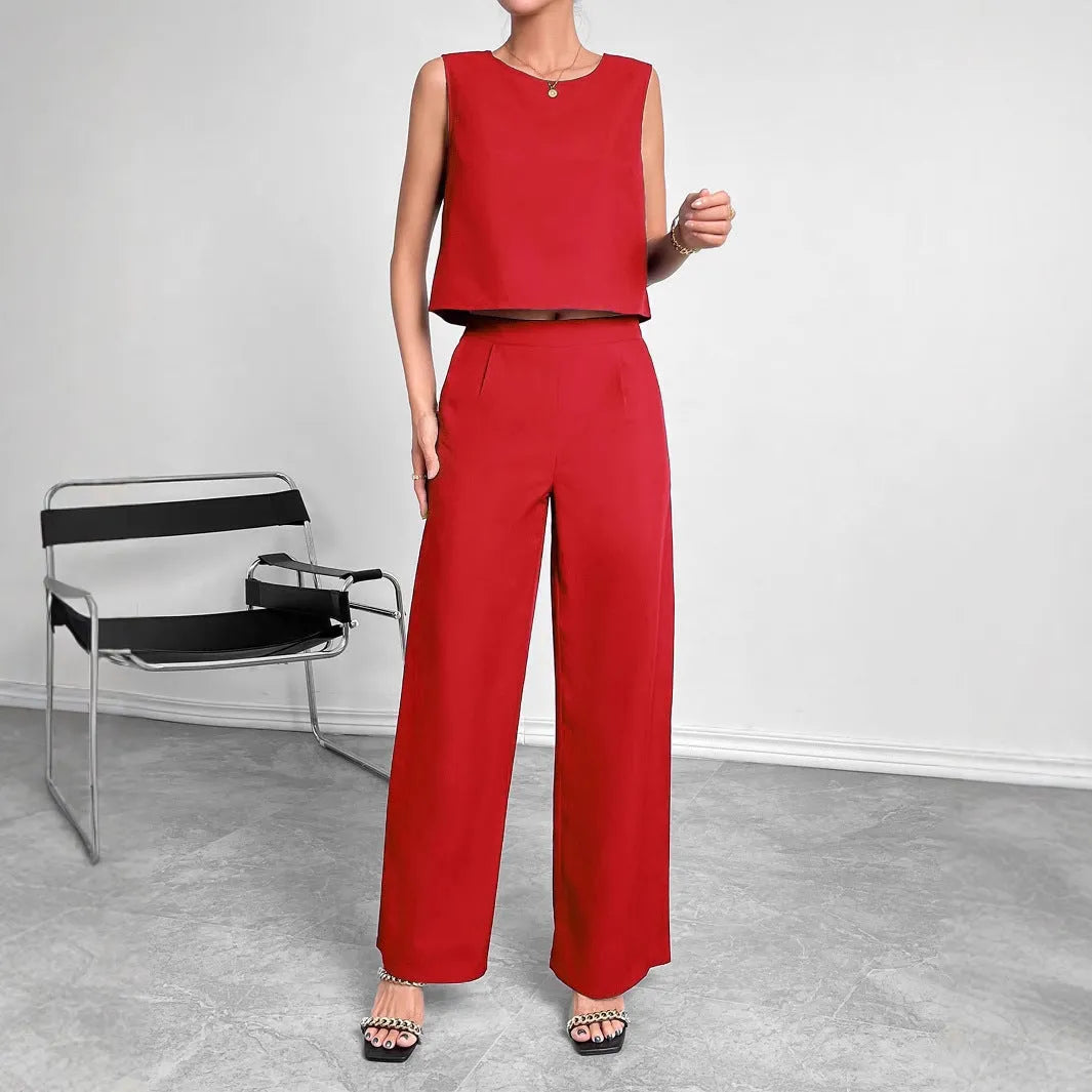 Women's red polyester lounge set featuring sleeveless round neck top and wide leg pants