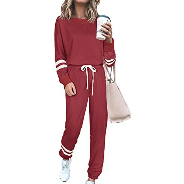 Women's plus size loose-fitting casual suit set in a solid colour, showing the long-sleeve top and matching trousers.
