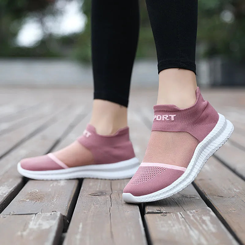 Casual grey Flyknit sock shoes with laces and a low-top MD sole, shown on a foot.