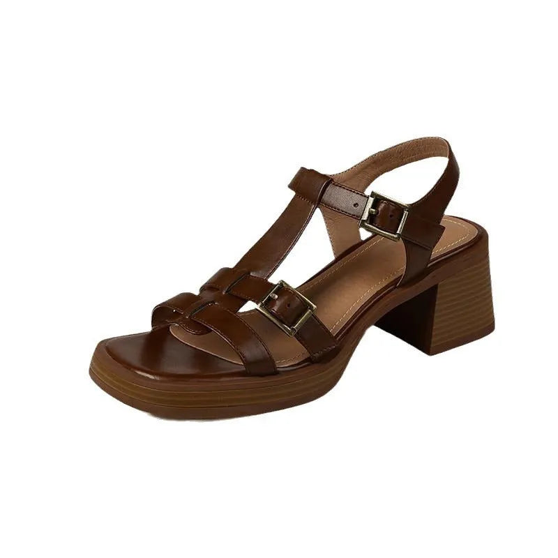 Black retro women's sandals with a T-shaped buckle, open square toe, and a chunky platform heel.