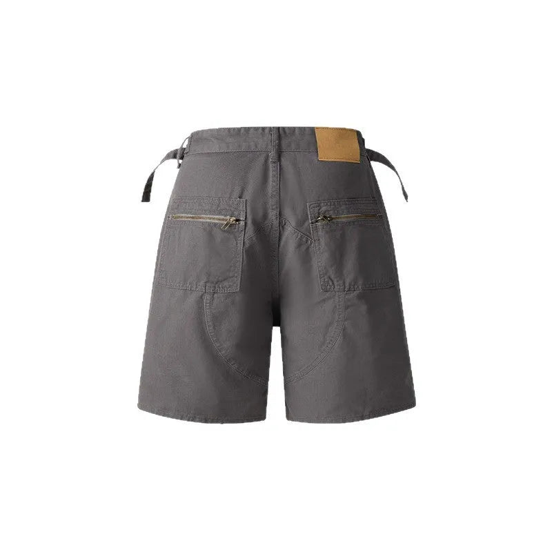 Retro loose-fit workwear shorts with a zipper, made from washed cotton cloth.