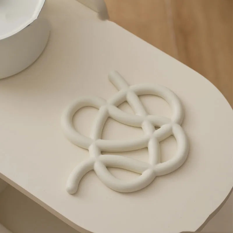 Ceramic heat proof mat in irregular shape with modern solid colour design for table protection