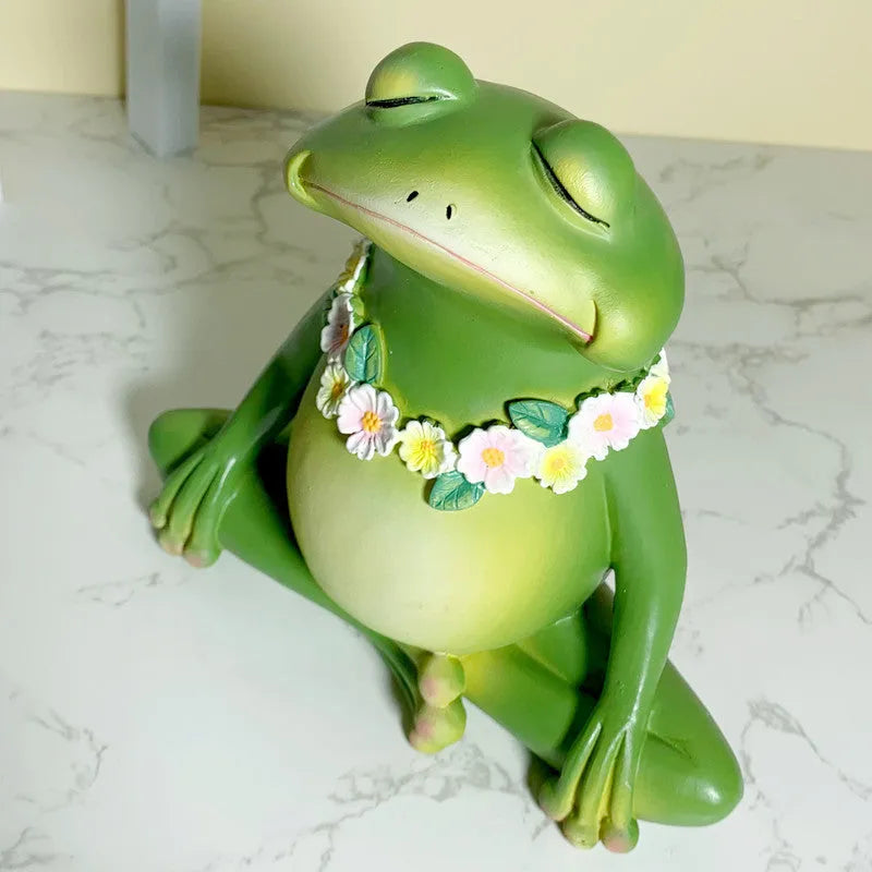 European style Magic Yoga Frog plastic resin ornament in RDW123 colour on a tabletop.