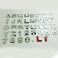 Zinc alloy 3D car bumper sticker showing raised metallic letter on black background