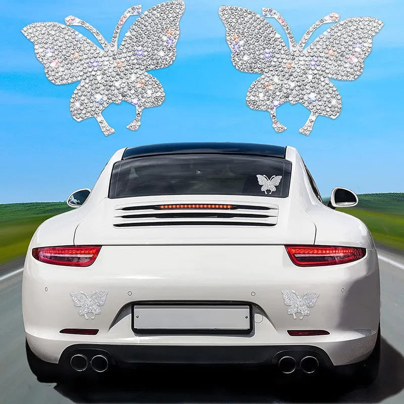 Diamond-encrusted bear paw and butterfly car sticker on vehicle surface