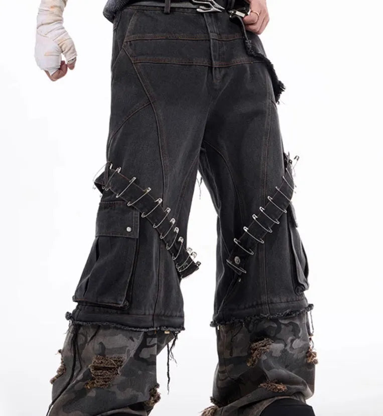 Men's grey camouflage jeans with splicing panels and ribbon detail on cotton denim.