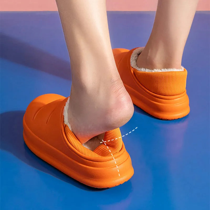 Women's waterproof EVA garden slippers in assorted colours with plush lining and non-slip soles.