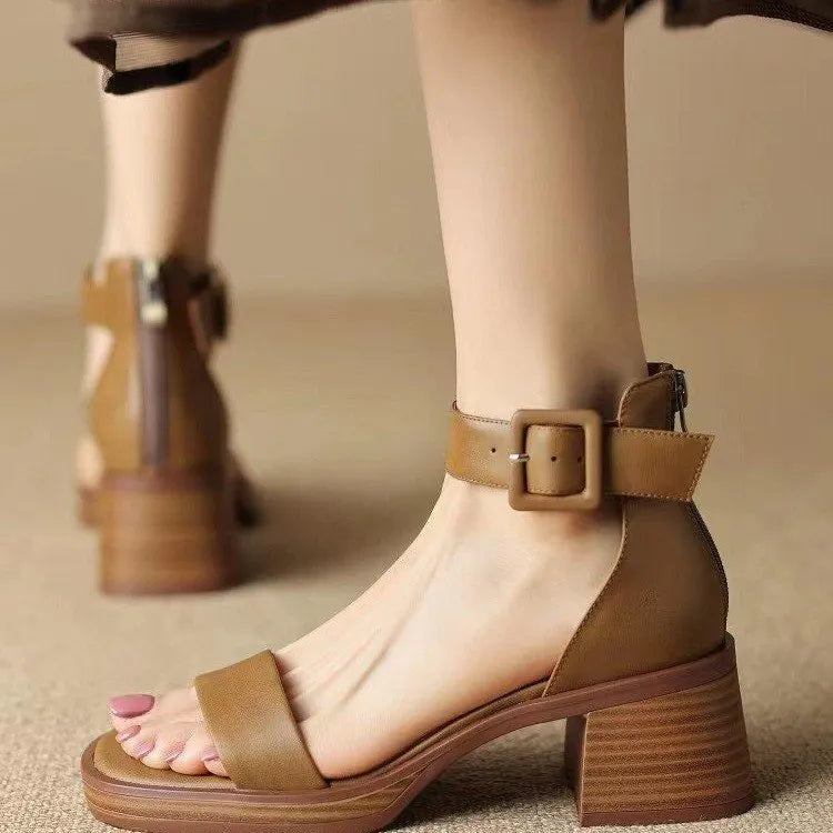 Women's white retro ankle-strap platform high heels with round toe and adjustable buckle.