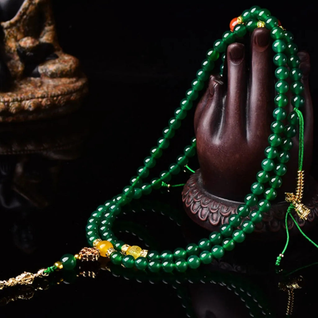 Handcrafted multi-circle green agate bracelet with natural stone beads on a wrist.
