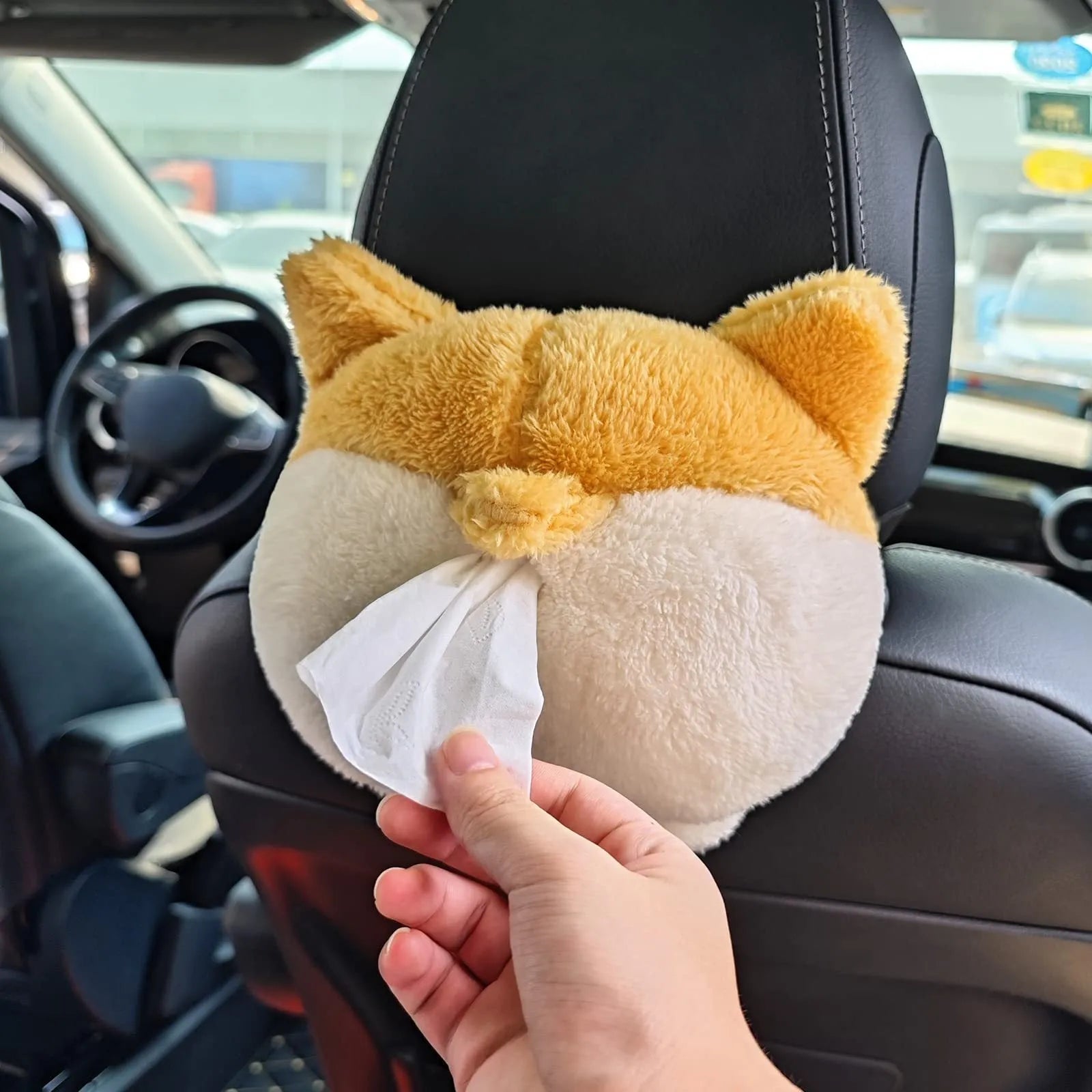 Yellow soft plush corgi butt shaped tissue box cover with elastic straps for car visor.