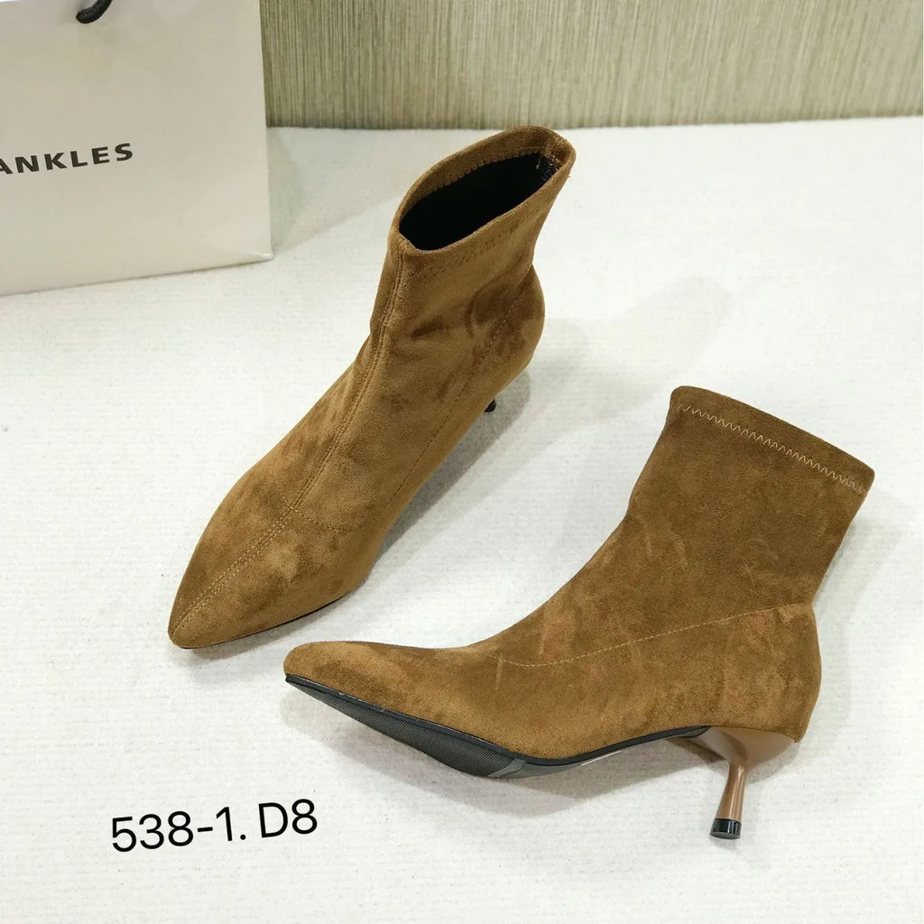 Black pointed toe stiletto heel ankle boots with microfiber upper and mid-calf length