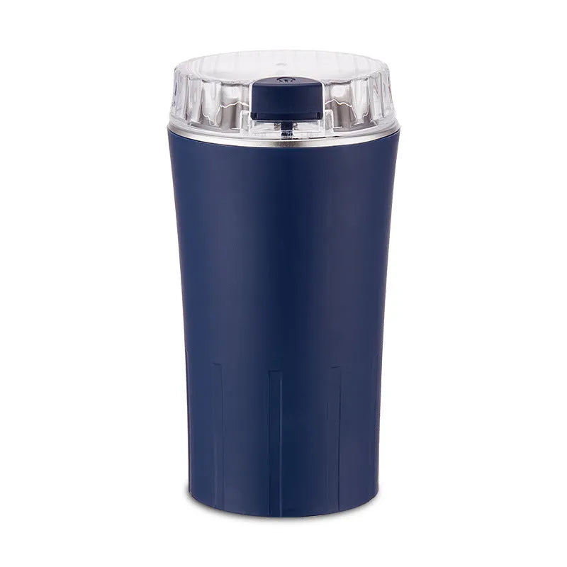 Blue compact electric mini flour mill and spice grinder on a kitchen countertop