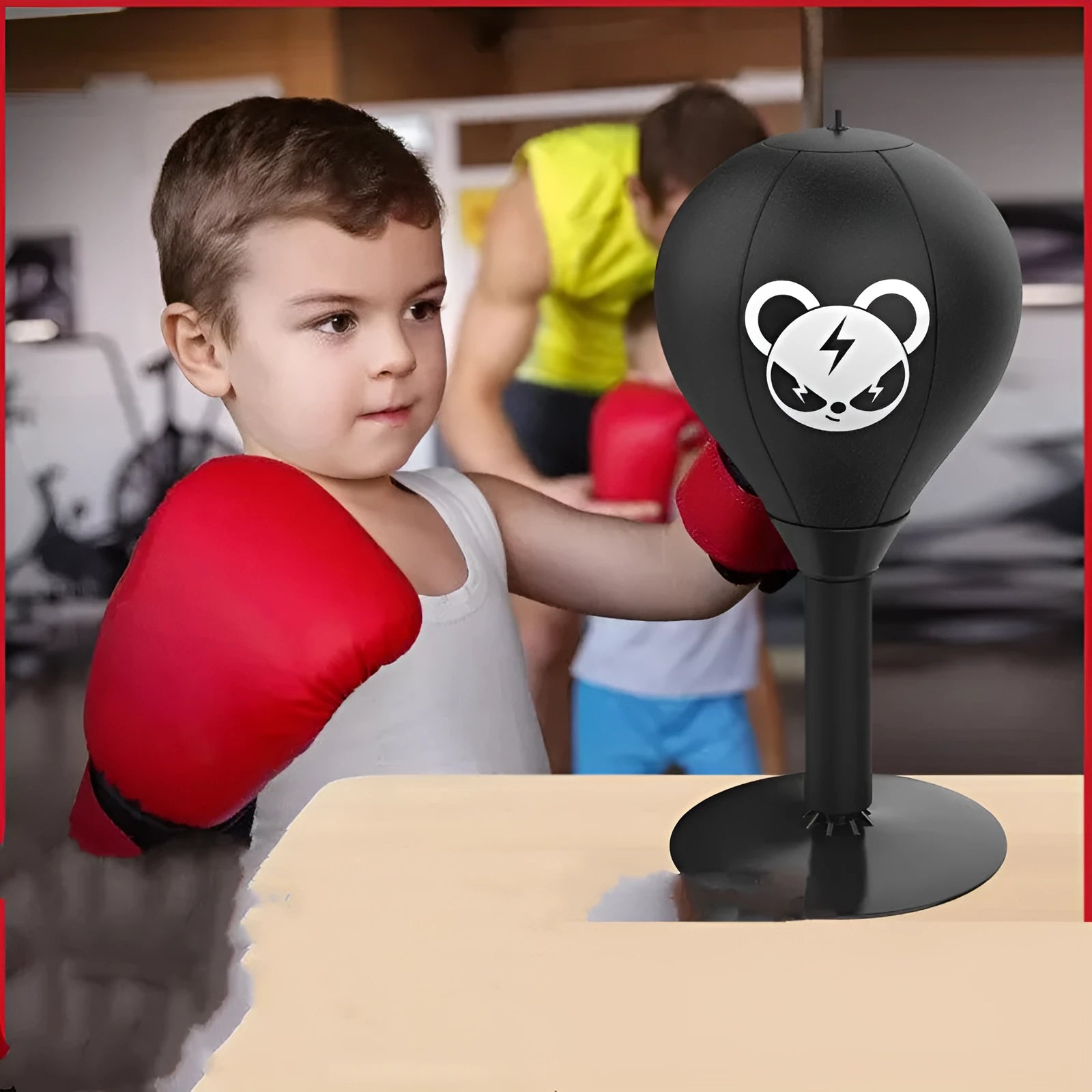 Tabletop boxing speed ball with suction cup base, inflatable PU leather ball, pump, and optional gloves on a desk.