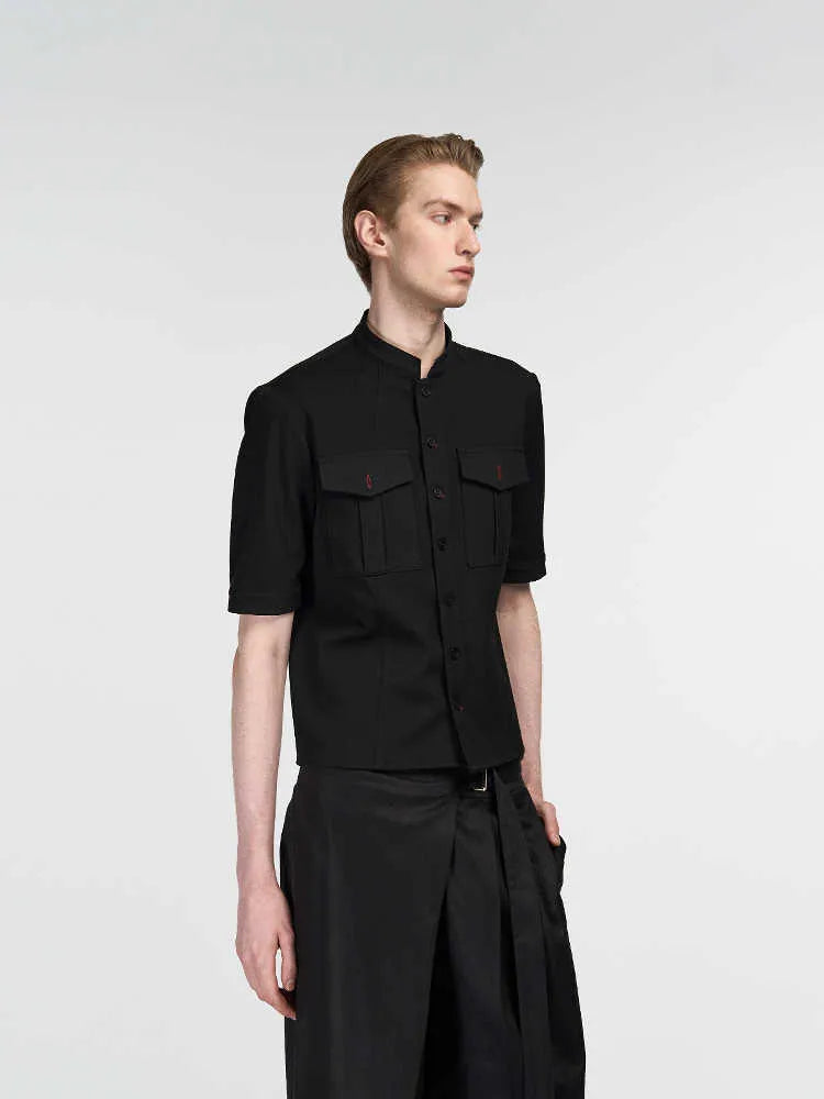 Handmade black loose fit half sleeve button-down shirt for men, shown on a hanger.