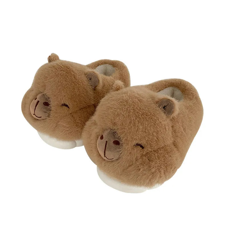 Light brown women's winter slipper boots with a cartoon pattern, cotton canvas upper, and artificial wool lining.
