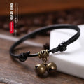 Adjustable nylon dog collar with brass bell in black rope colour with metal buckle