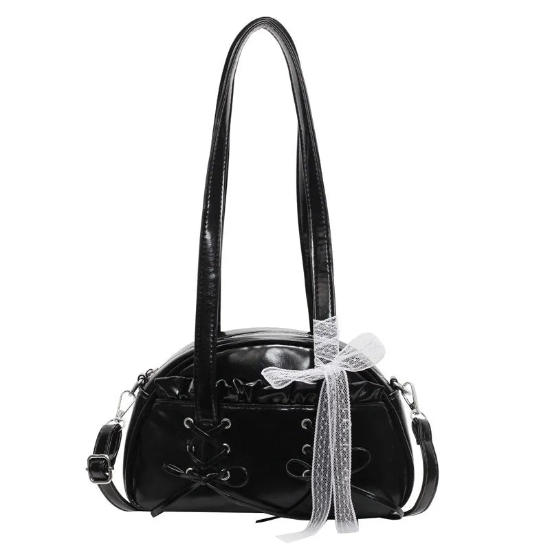 Women's white PU leather shoulder bag with a large bandage bow detail on the front.