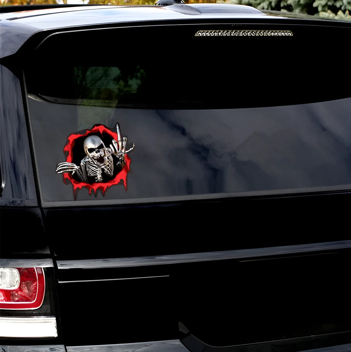 Reflective car sticker with metal skull and colourful broken shell pattern measuring 15cm by 14cm