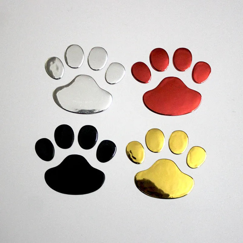 PVC dog footprint car sticker in black, gold, red, and silver colour options, measuring 7cm.