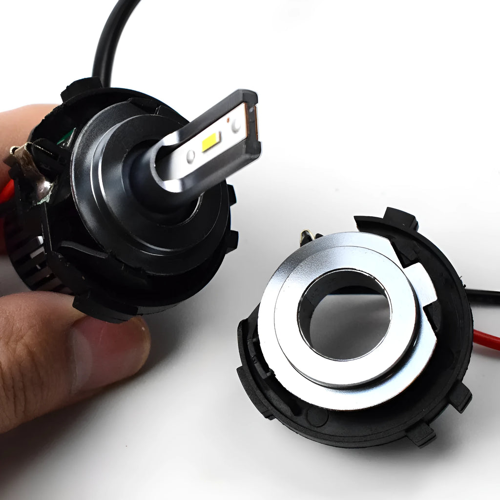 Black plastic H7 LED headlight adapter bracket with copper wiring for Volkswagen cars.