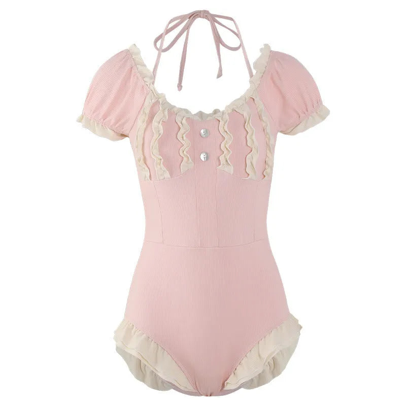 Pink women's conservative one-piece swimsuit with a Siamese cute design on a mannequin