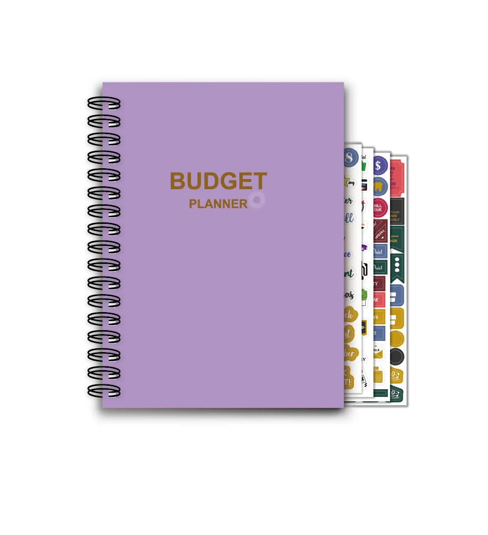 Purple coil-bound A5 financial planning notebook with pen, stickers, and paper clips for monthly budgeting