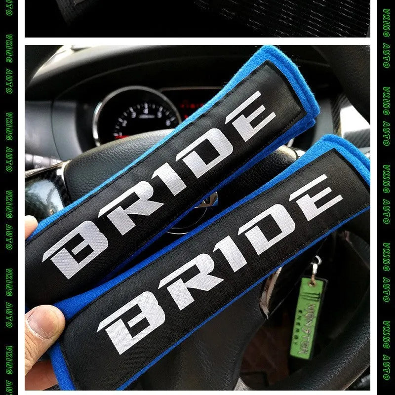 Car seatbelt shoulder pads with embroidery detail in black, blue, and red colour options