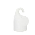 DOMI Elephant-shaped silicone night light in white with warm LED glow on a bedside table.