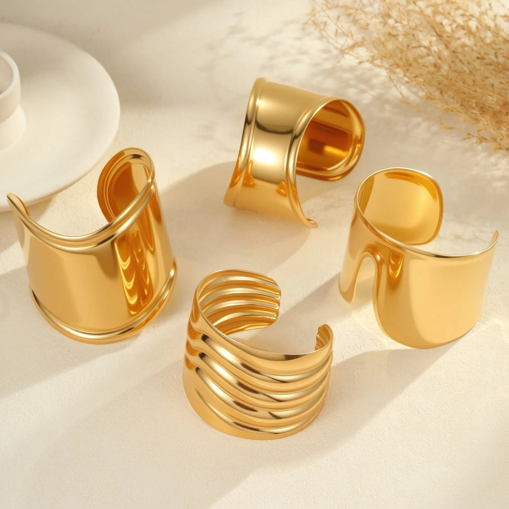 Women's stainless steel bracelet with geometric wave design and gold plating