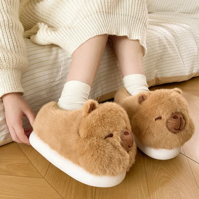 Light brown women's winter slipper boots with a cartoon pattern, cotton canvas upper, and artificial wool lining.