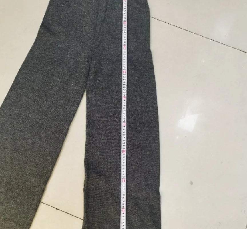 Women's dark grey acrylic sweater suit with side slits and matching trousers