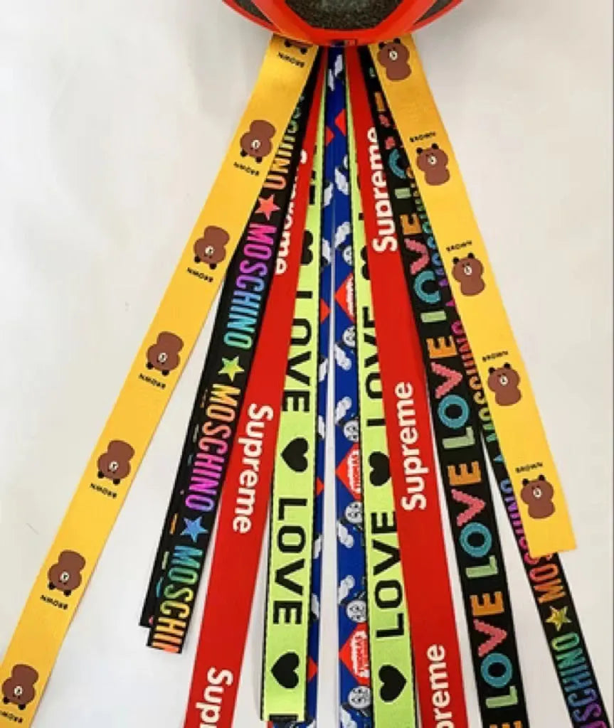 Decorative ribbon streamer for a child's ski or skating helmet in various colour options.