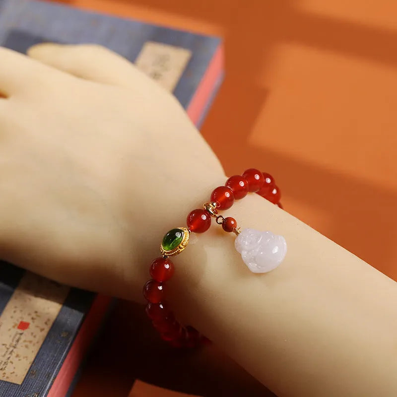 Handcrafted red agate and amber bracelet with geometric design and gold Maitreya Buddha charm