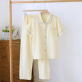 Washed cotton short-sleeved trouser set in a loose, casual style for summer, shown in a floral or plaid pattern.