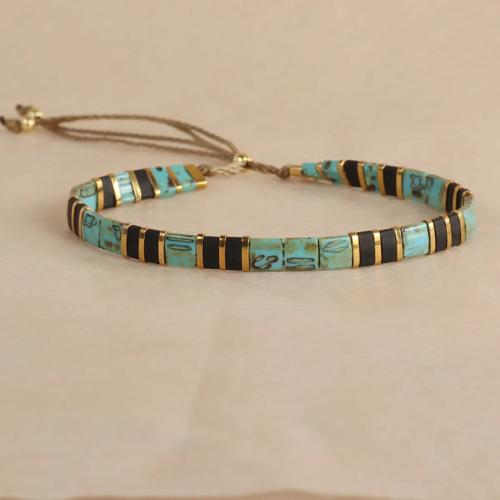 Geometric glass beaded bracelet in milky white, black, green, blue, or red with round elements