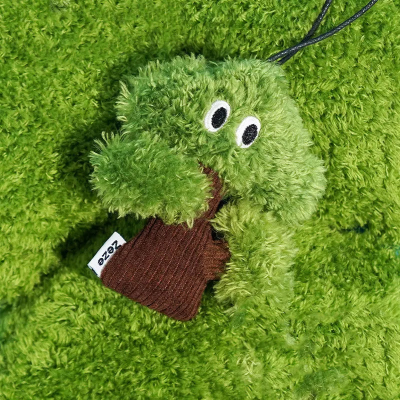 Pine tree-shaped hanging cat chew toy with mint filling, shown next to a ruler for scale