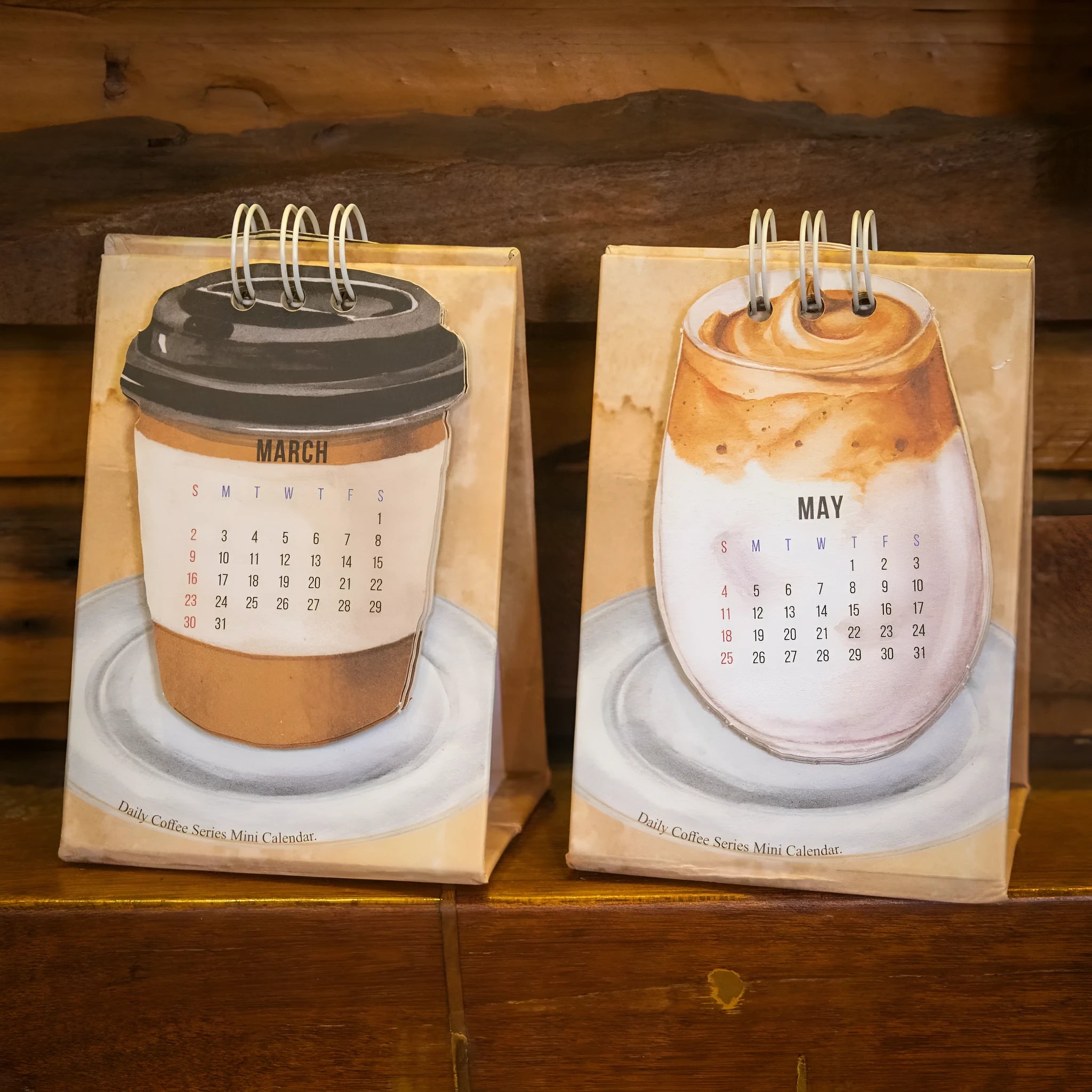 Mini coffee-themed desk calendar showing 2025 dates with motivational text