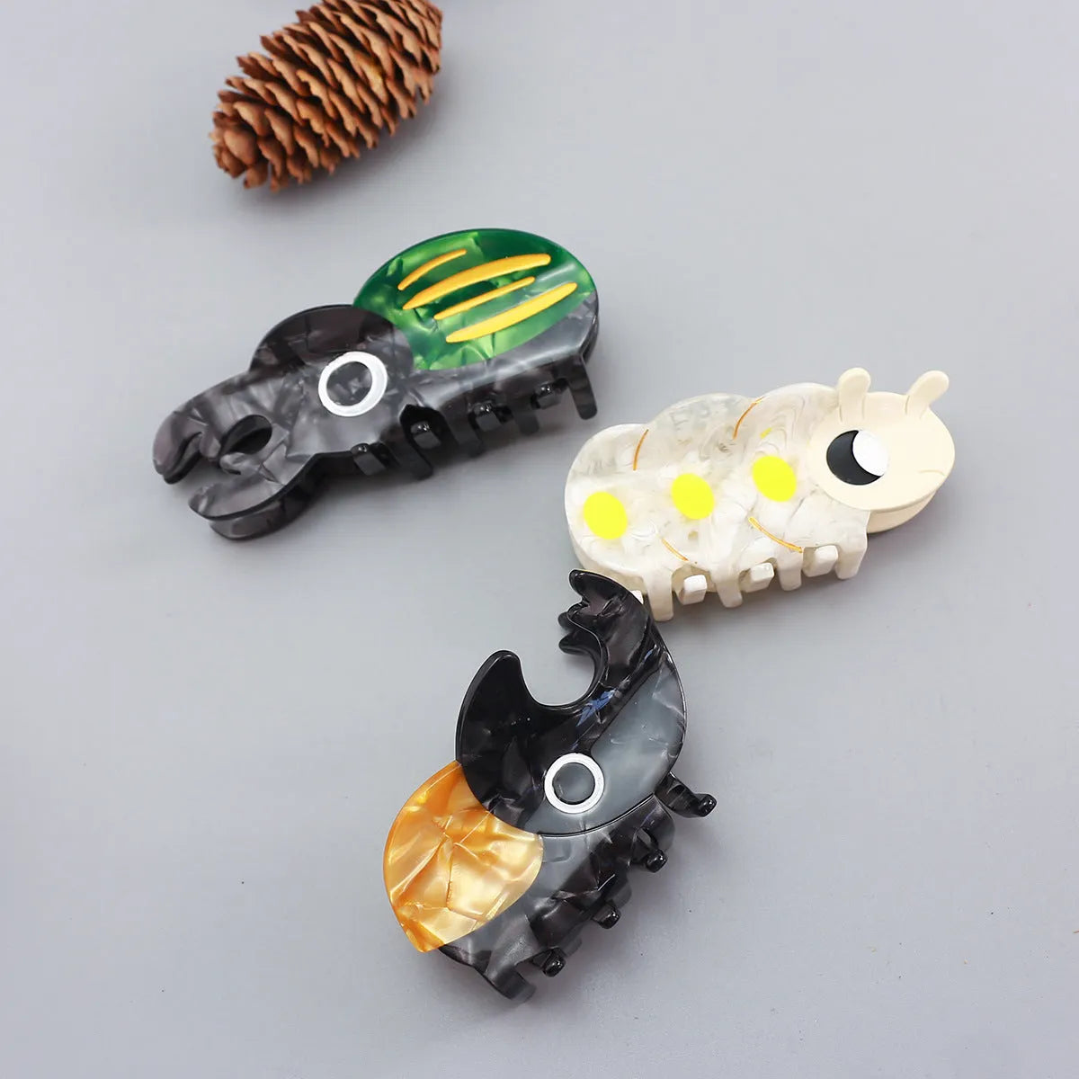 Handmade green cellulose acetate beetle grip keychain with cartoon caterpillar decoration