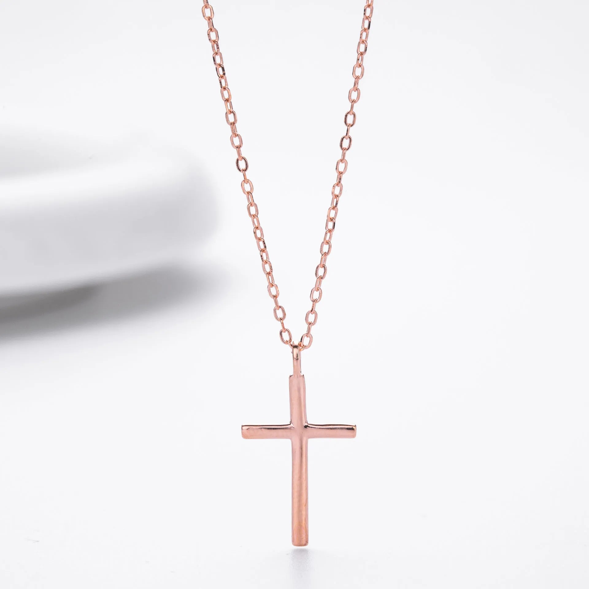 Sterling silver cross pendant necklace on an adjustable O-chain in gold, platinum, or rose gold plating.
