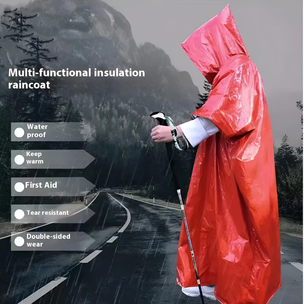 Adult in orange Marathon Wild cross-country rain poncho outdoors in rain.